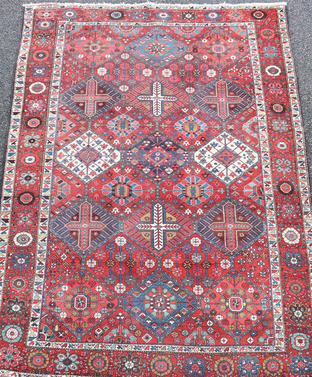 A Bakhtiari red ground carpet circa 1900, 10ft by 7ft 2in.